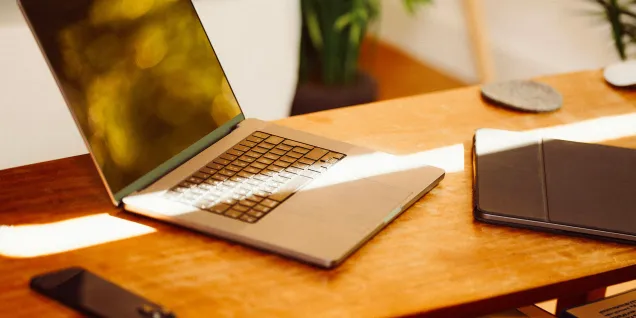 A computer and other devices on a table