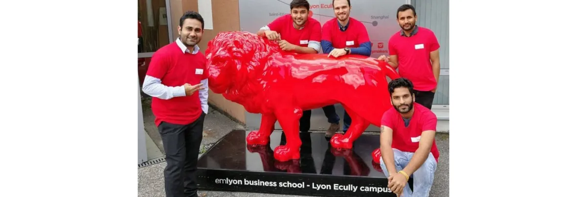 The IMBA participants are dressed in red